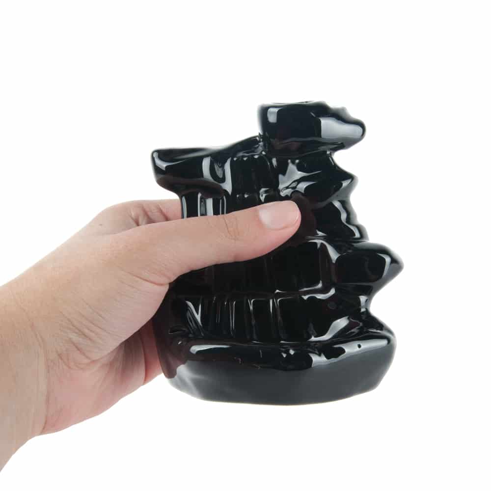 quemador incienso en cascada backflow de reflujo en la mano